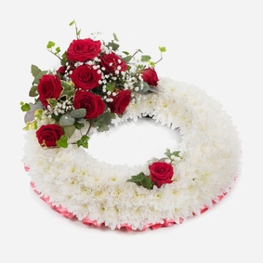 White Massed Wreath with red rose spray
